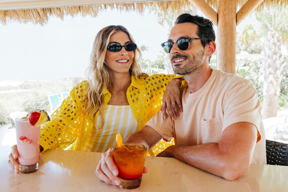 A couple enjoys cocktails at Sandbar.