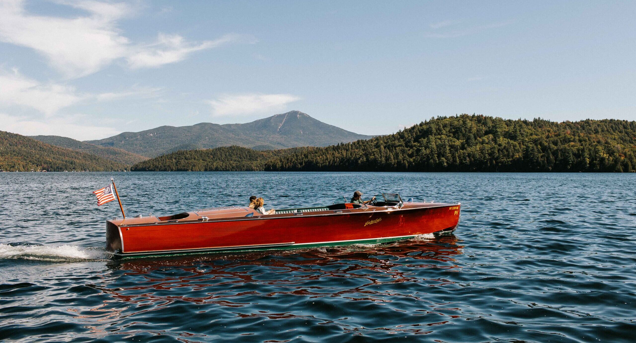 A couple cruises on Lake Placid.