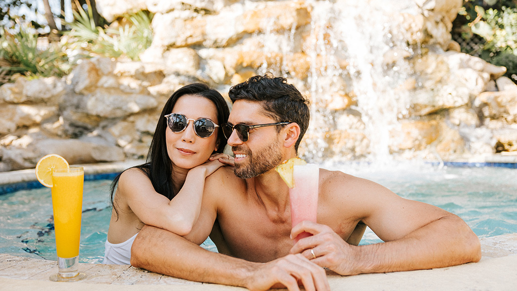 A couple soaks in the hot tub at The Lucie.