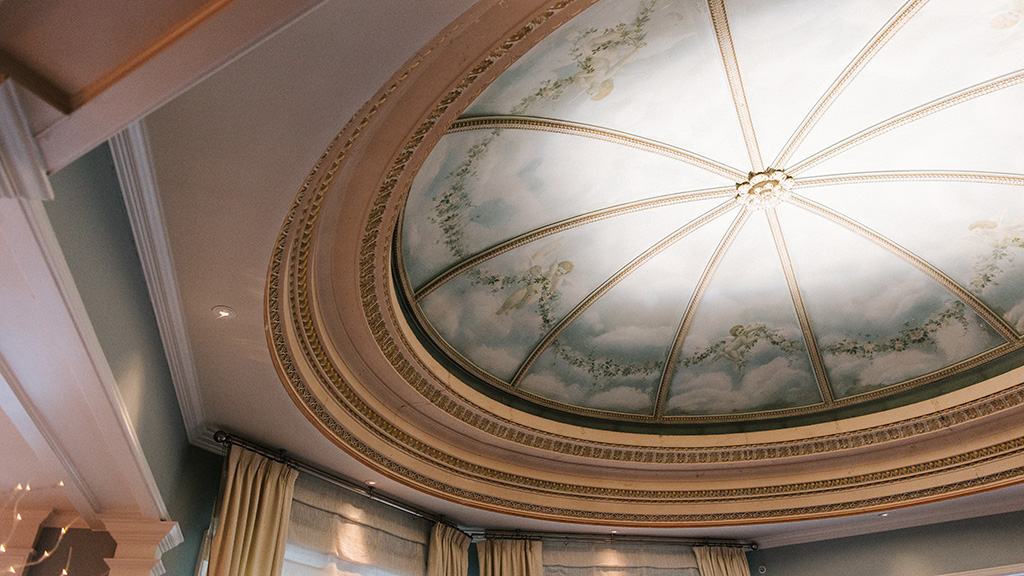 A close-up of the mural that is painted on the domed ceiling at Salt Kitchen & Bar.