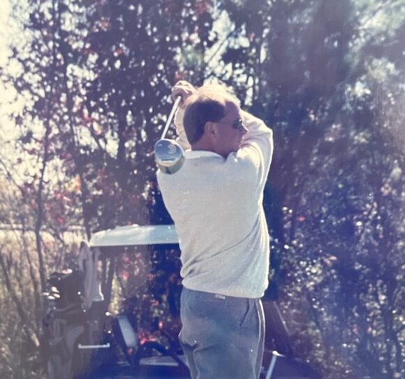 Gary Soule swings a club on the course.