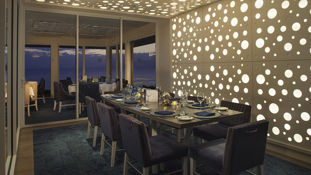 Latitudes private dining room at night at Delray Sands Resort.