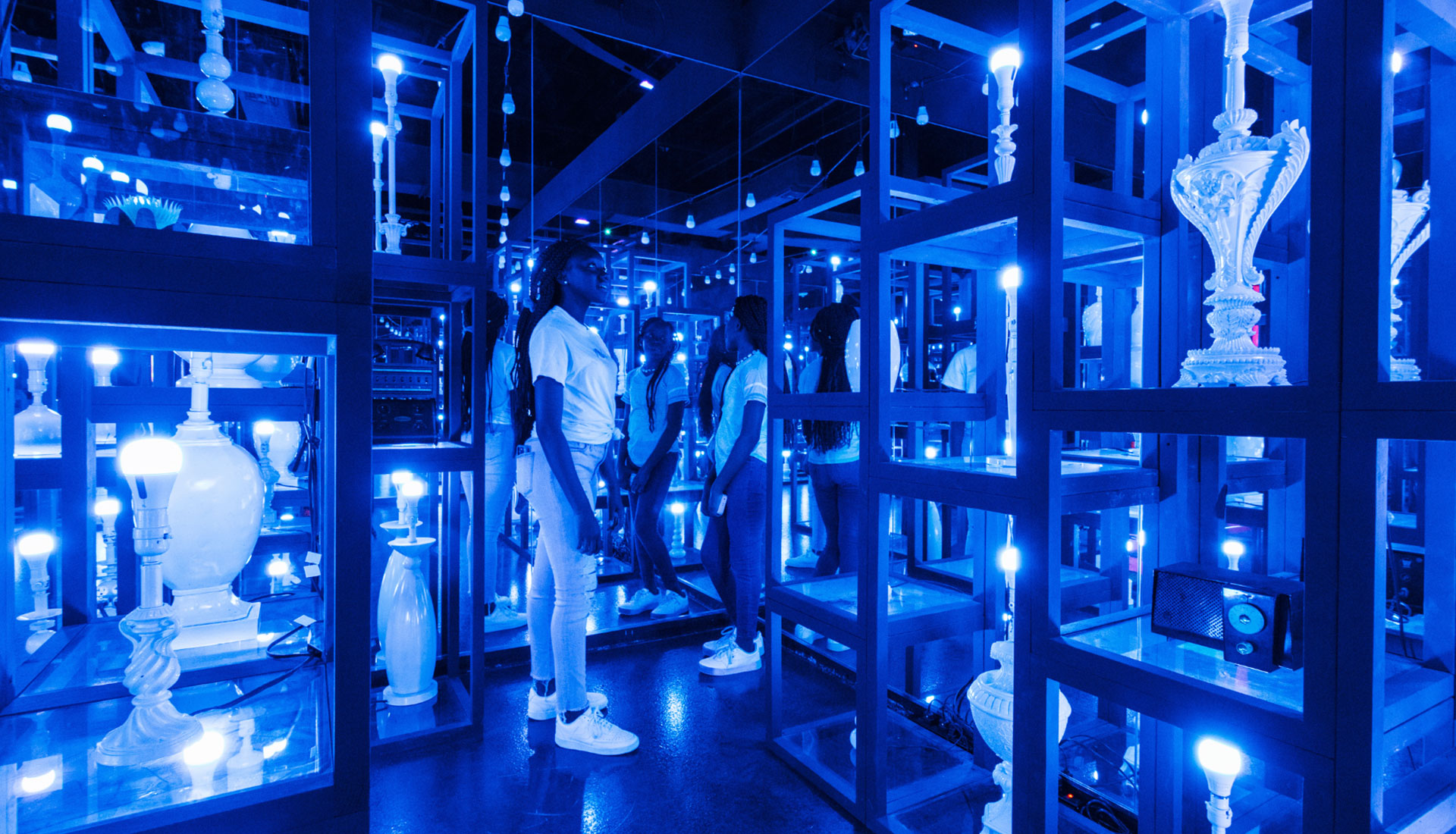 Museum-goers stroll through the 