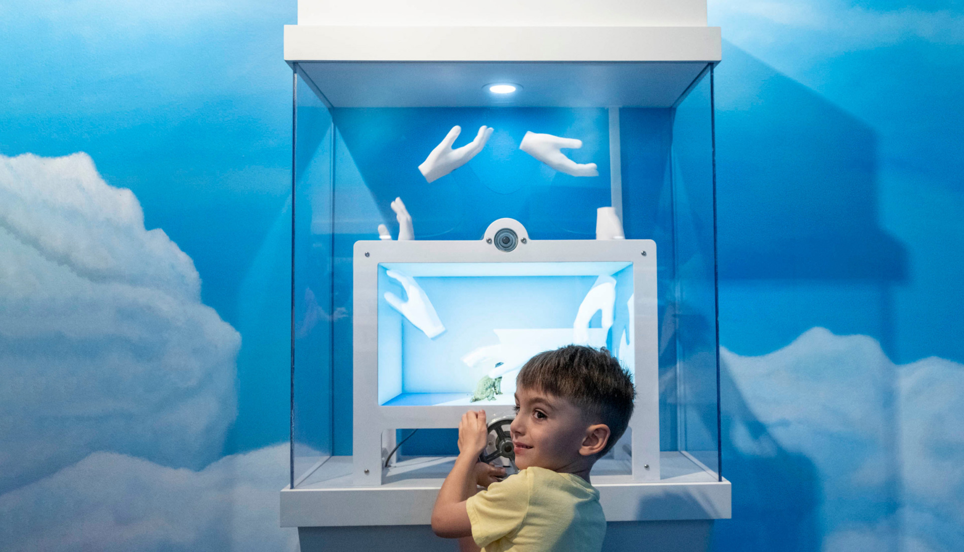 A child plays with a interactive device in the 