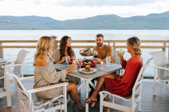 A group of friends dine at The Sagamore Resort.