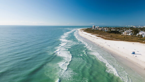 An aerial shot of the sparkling blue waters of Siesta Key near Sarasota, Florida.