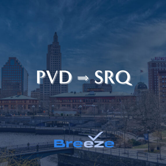 City skyline with historic buildings under a blue sky. The letters PVD ⇒ SRQ are displayed prominently, with Breeze written below, featuring a stylized check mark logo.