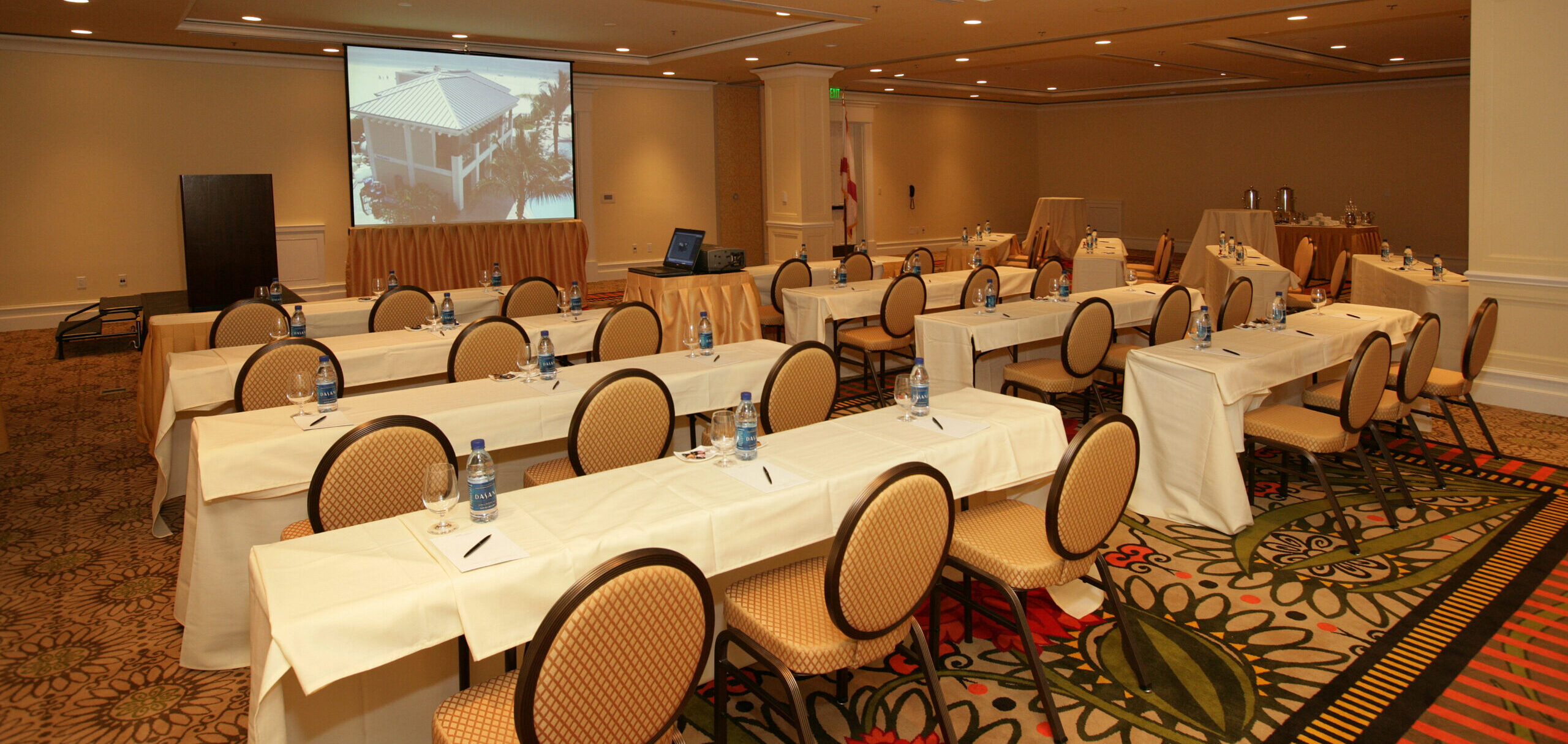 A conference room with rows of empty tables and chairs set up classroom style at Sandpearl Resort in Clearwater Beach, Florida.