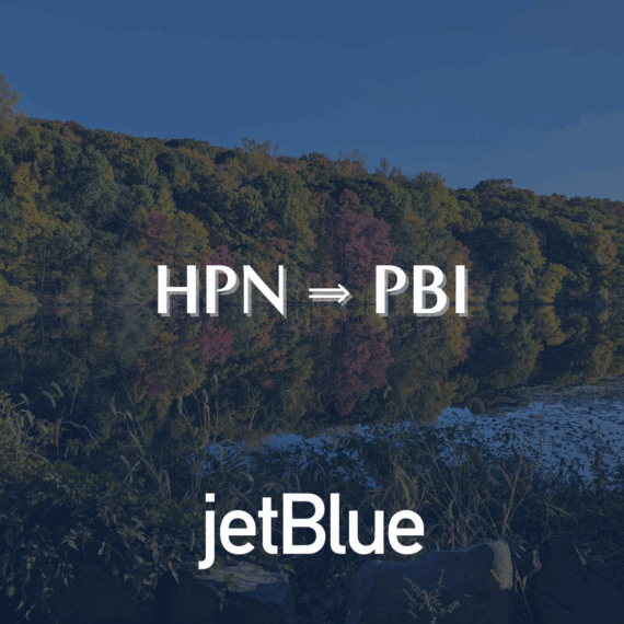 A scenic autumn landscape with colorful trees reflected in water. Overlaid text reads HPN ⇨ PBI and jetBlue at the bottom, suggesting a flight route between these airports.