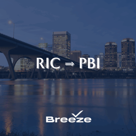 City skyline and bridge at dusk with the text RIC ⇒ PBI and the Breeze Airways logo at the bottom.