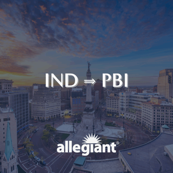 A cityscape view of downtown Indianapolis at sunset with the Soldiers and Sailors Monument in the center. Text reads “IND ⇒ PBI” and “allegiant” with a sunburst logo below.