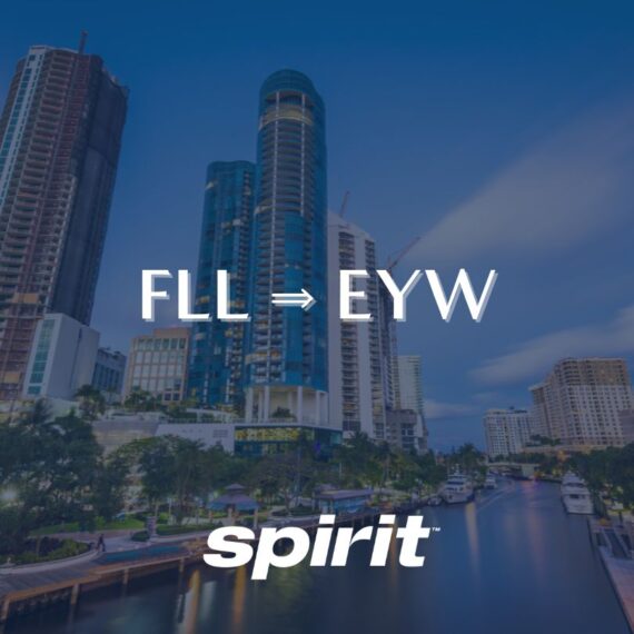 A cityscape with tall modern buildings and a canal at sunset. Overlaid text reads “FLL ⇒ EYW” and “spirit” at the bottom, suggesting a Spirit Airlines flight route from Fort Lauderdale to Key West.