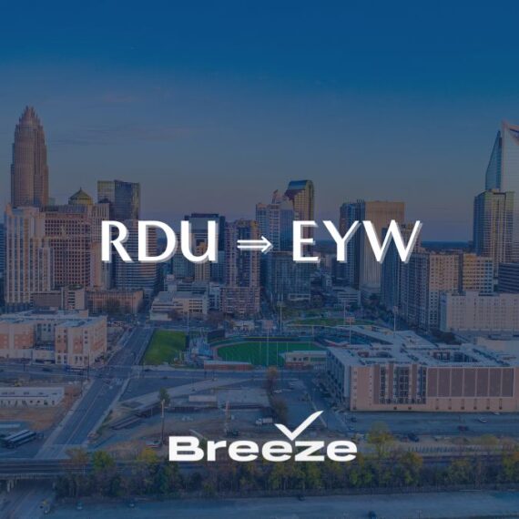 A city skyline at sunset with the text RDU → EYW and the Breeze airline logo, indicating a new flight route from Raleigh-Durham to Key West.