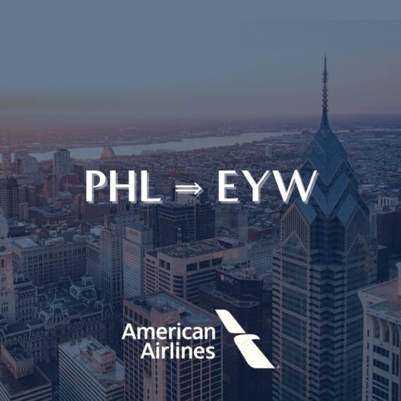 A city skyline with the American Airlines logo and text reading PHL ⇒ EYW, indicating a flight route from Philadelphia to Key West.