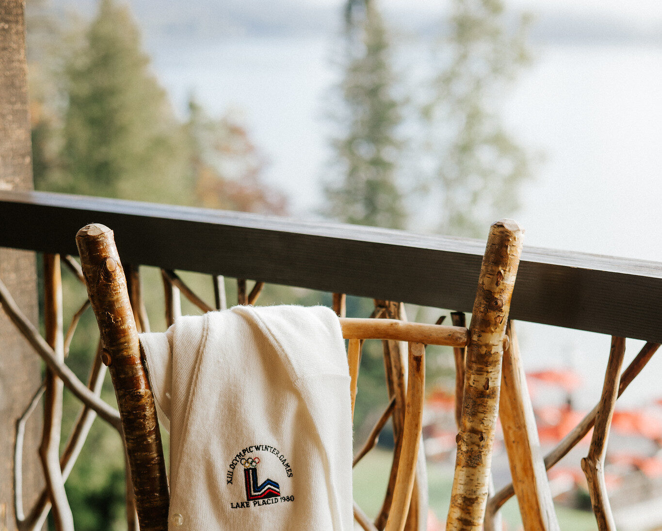 Vintage olympic sweater on a wooden chair