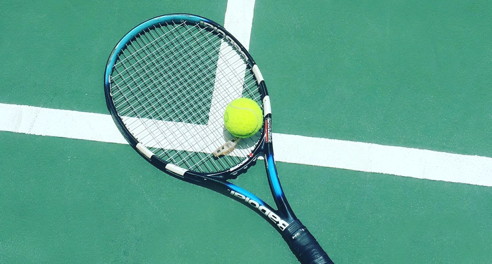 tennis racquet and ball