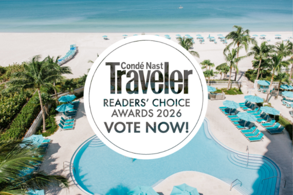 Aerial view of a tropical beach resort with a pool, palm trees, and turquoise lounge chairs. Text overlay reads: “Condé Nast Traveler Readers’ Choice Awards 2026 VOTE NOW!”.