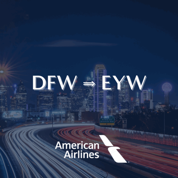 Night view of a city skyline with light trails from cars. Text reads DFW ⇒ EYW above the American Airlines logo at the bottom of the image.