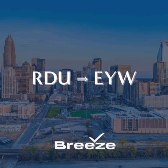 A city skyline at sunset with RDU → EYW in large text and the Breeze Airways logo below, indicating a new flight route.