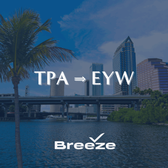 A view of a city skyline with tall buildings, a palm tree, and water in the foreground. Text reads TPA ⇒ EYW and Breeze with a checkmark logo.
