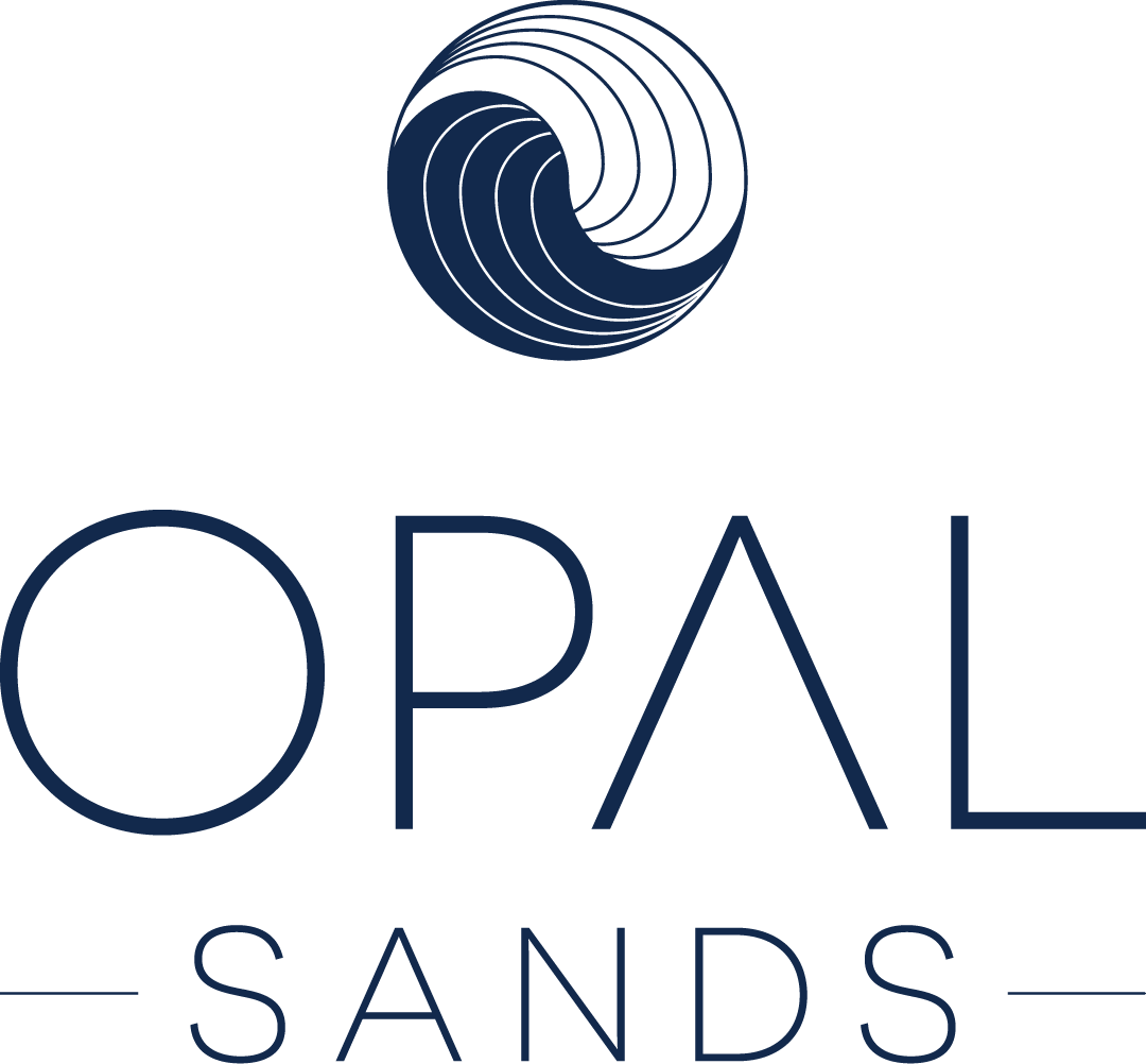 Logo for Opal Sands featuring a stylized blue wave circle above the words OPAL SANDS in modern, thin, uppercase letters on a light background.