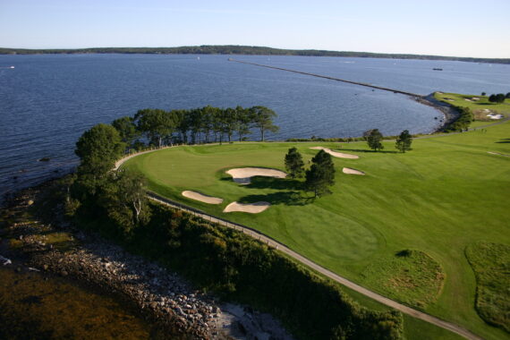 arial view of golf course with ocean