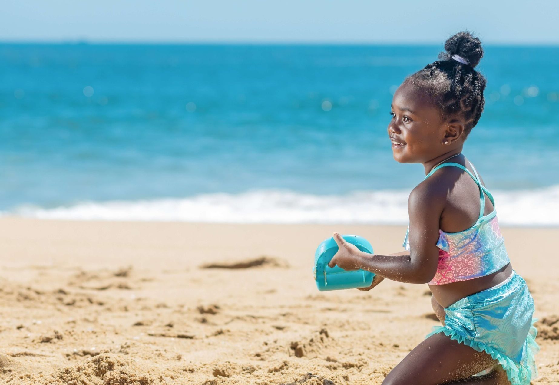 child playing on the beach