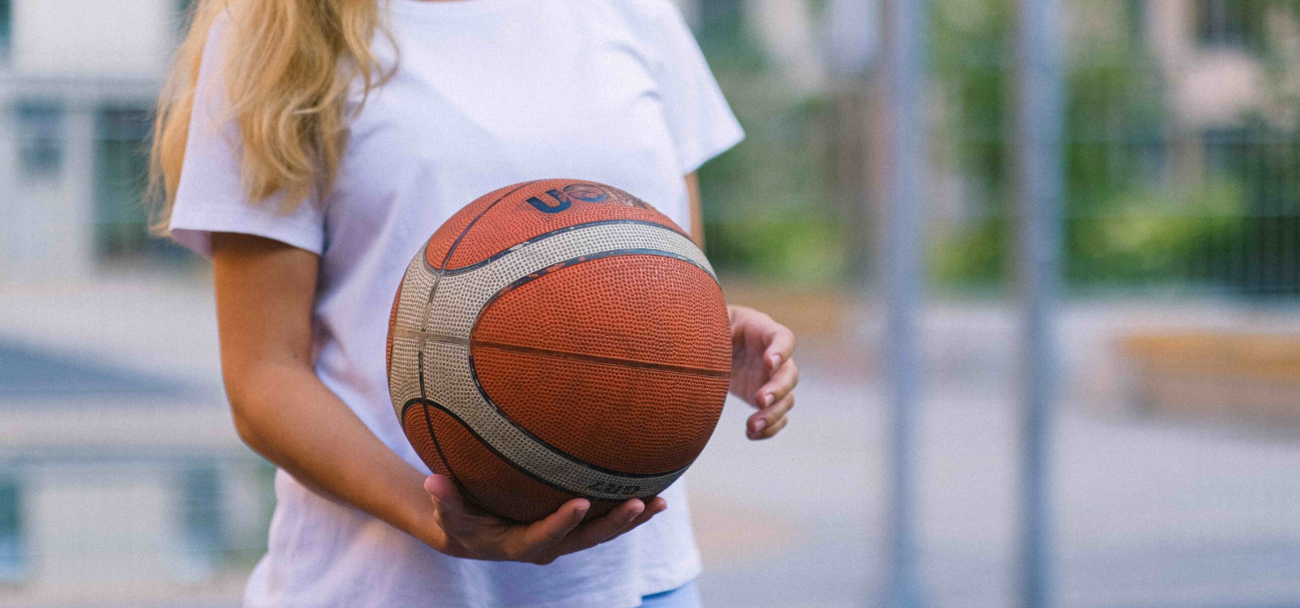 woman holding a basketball