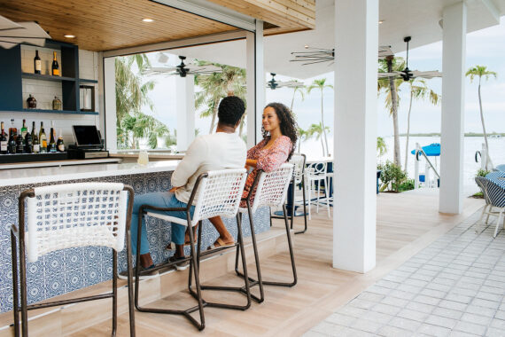 Man and women sitting at bar