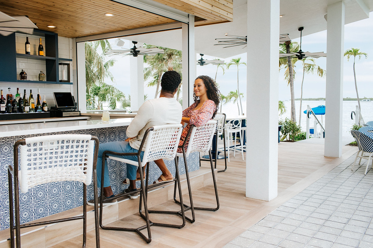 Man and women sitting at bar