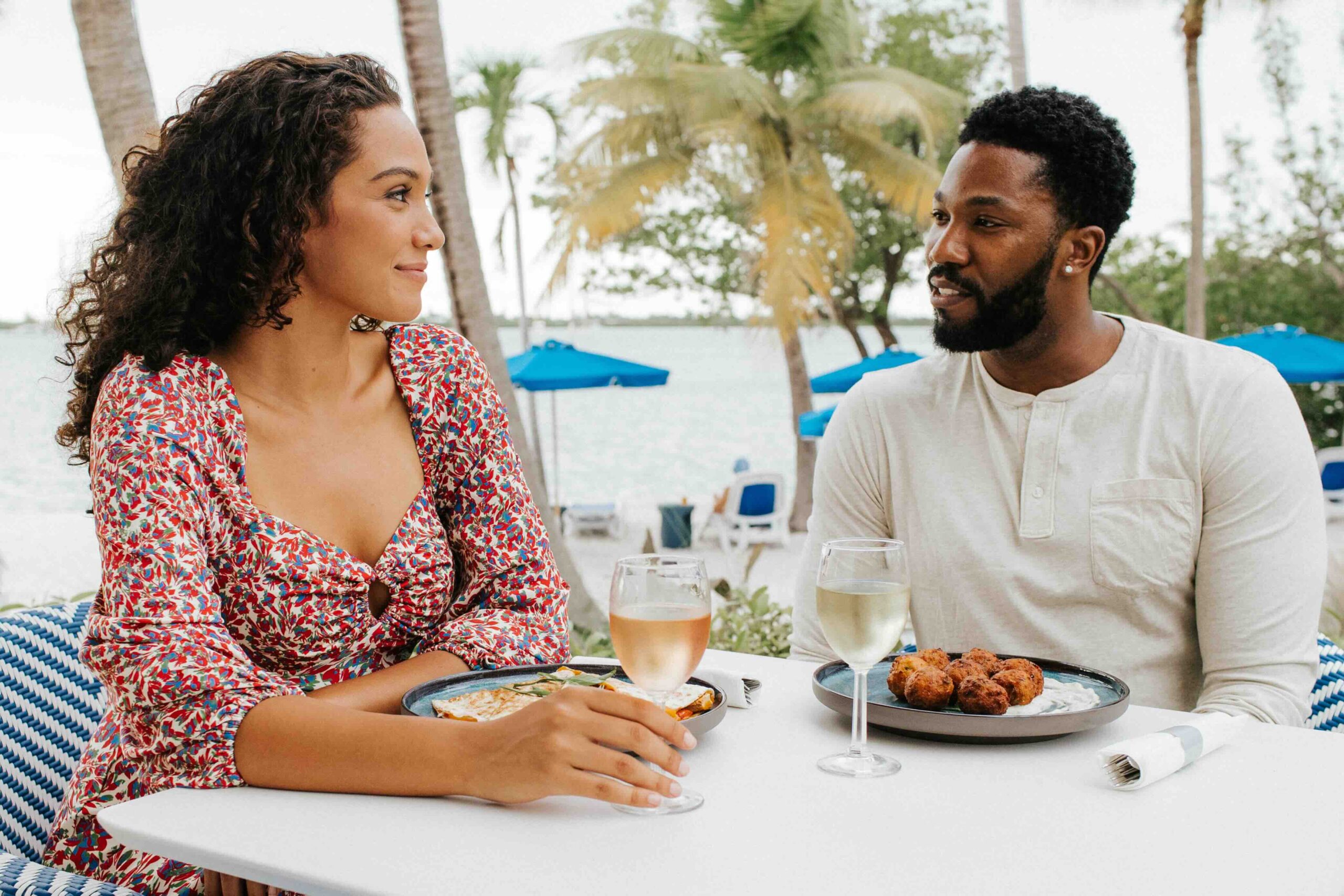 couple enjoying a seafood meal at The Capitana