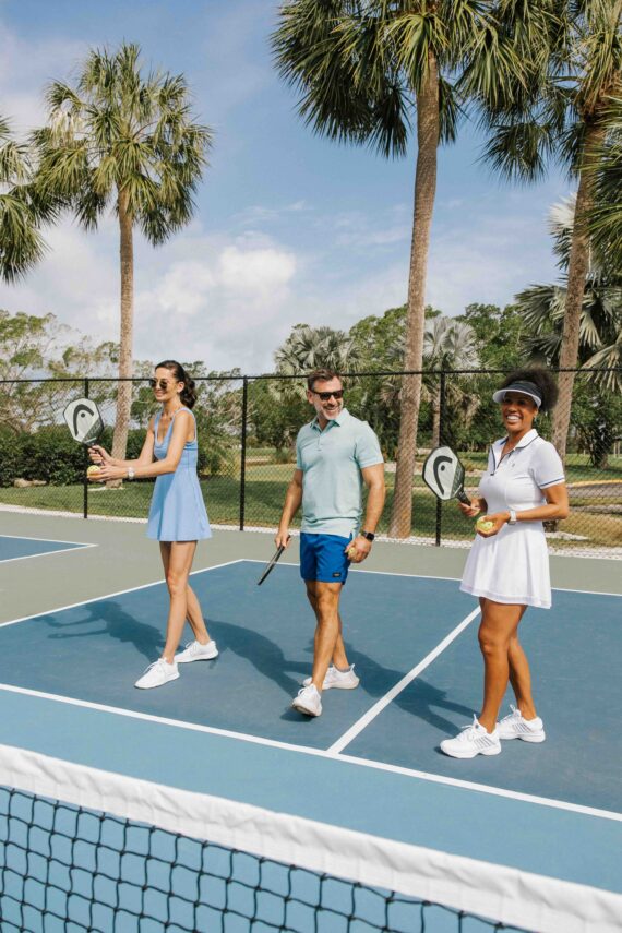 couple taking a tennis lesson