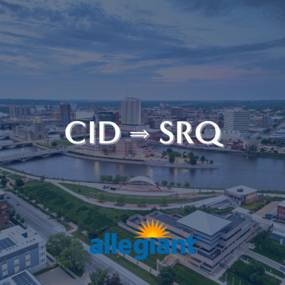 Aerial view of a cityscape with a river, buildings, and a cloudy sky. Text overlay shows CID ⇒ SRQ with the Allegiant logo below.