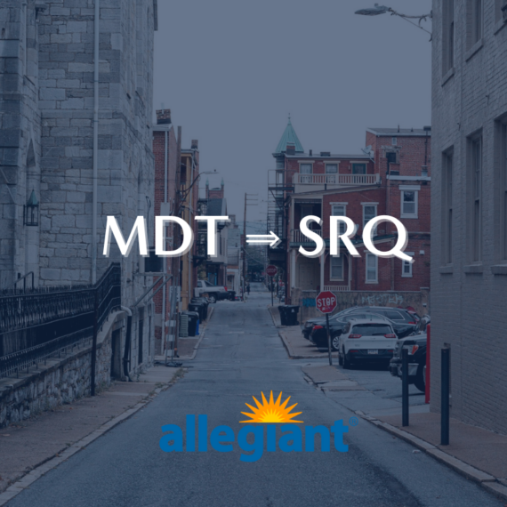 A narrow urban street with parked cars on each side. MDT → SRQ is written in bold white text, and the Allegiant logo, featuring a sun design, is at the bottom. The scene has an overcast sky and an alleyway feel.