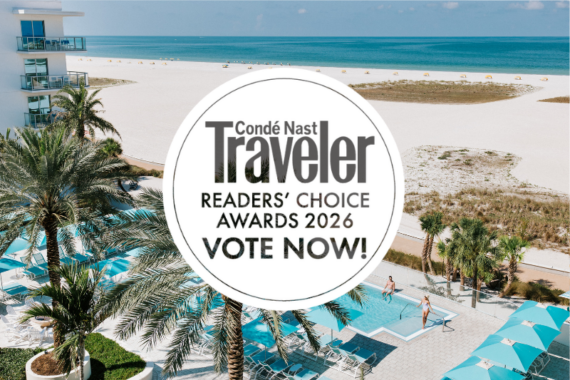 A coastal resort with palm trees, a pool, and lounge chairs overlooks a white sandy beach and blue ocean. A large circle displays Condé Nast Traveler Readers Choice Awards 2026 Vote Now! in bold text.