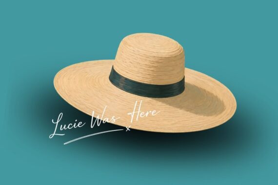 A wide-brimmed straw hat with a dark band sits on a teal background. White script text near the hat reads, Lucie Was Here.