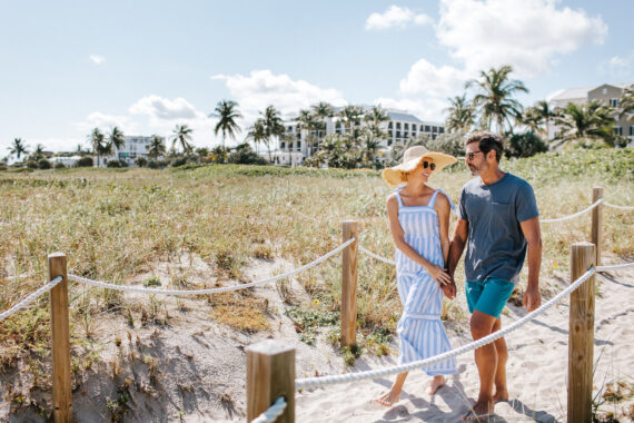 couple walking to the beach