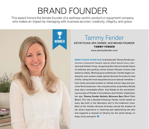 A smiling woman with straight blonde hair stands beside a gray wall, wearing a white coat. A blue WINNER badge appears near her head and founder details and achievements are written on the right side of the image.