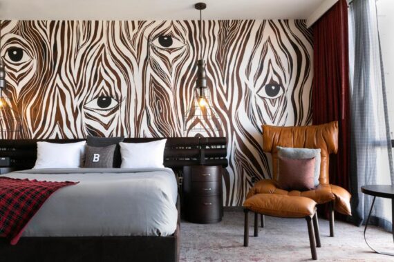 A suite at Bobby Nashville with zebra-inspire wallpaper and modern furniture.