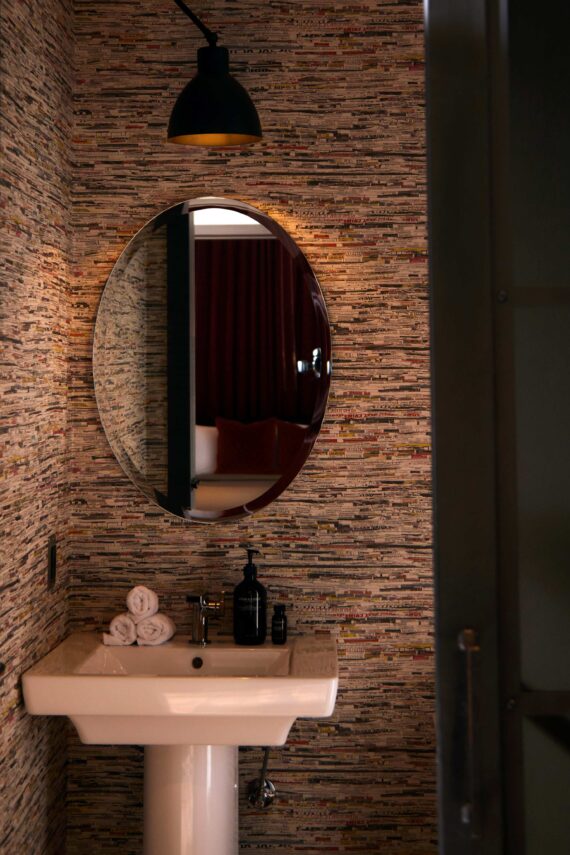 Small sink with mirror and low lighting at Bobby Nashville.