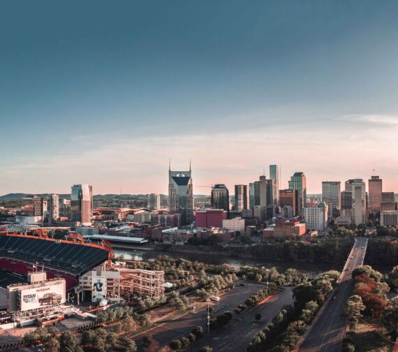 An aerial view of the skyline of Nashville at dusk.