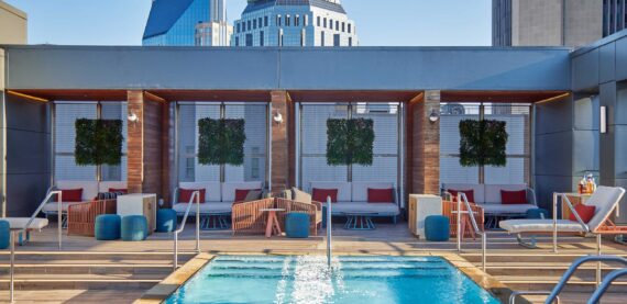 The rooftop pool at The Nash, resembling a sleek urban oasis.