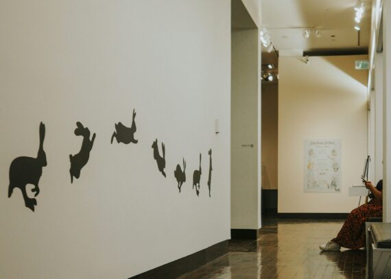 A woman sits in an art gallery in downtown Nashville