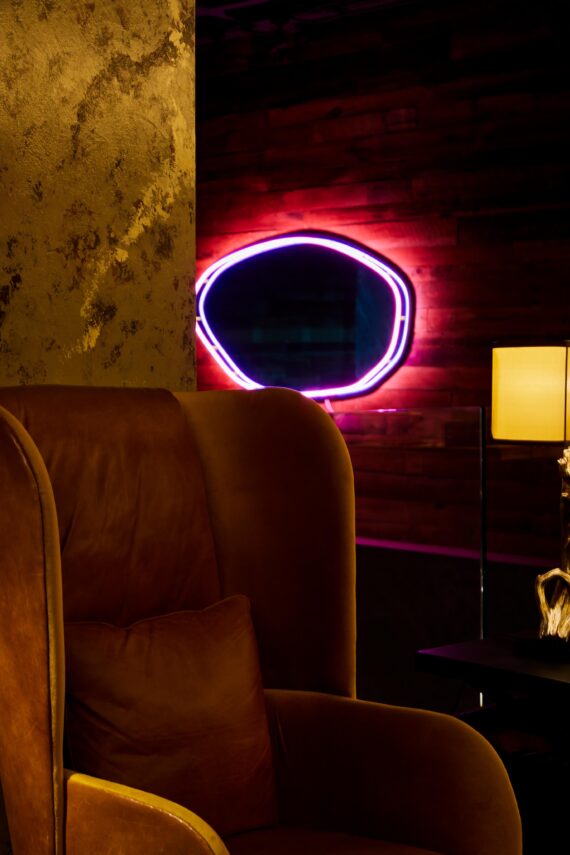 Neon-lit mirror on the wall of Bobby Nashville.