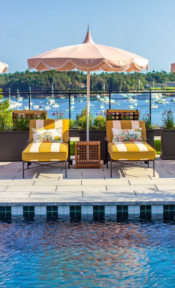 A detail shot of a the loungers and umbrella at the pool at The Asticou.
