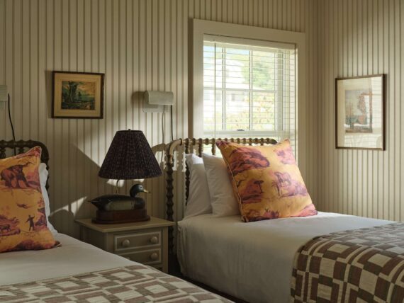 Two twin beds in one of the guestroom accommodations at The Asticou.