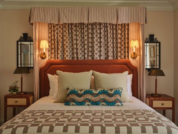 A detail shot of the stylish linens and pillows in one of the guestrooms at The Asticou.