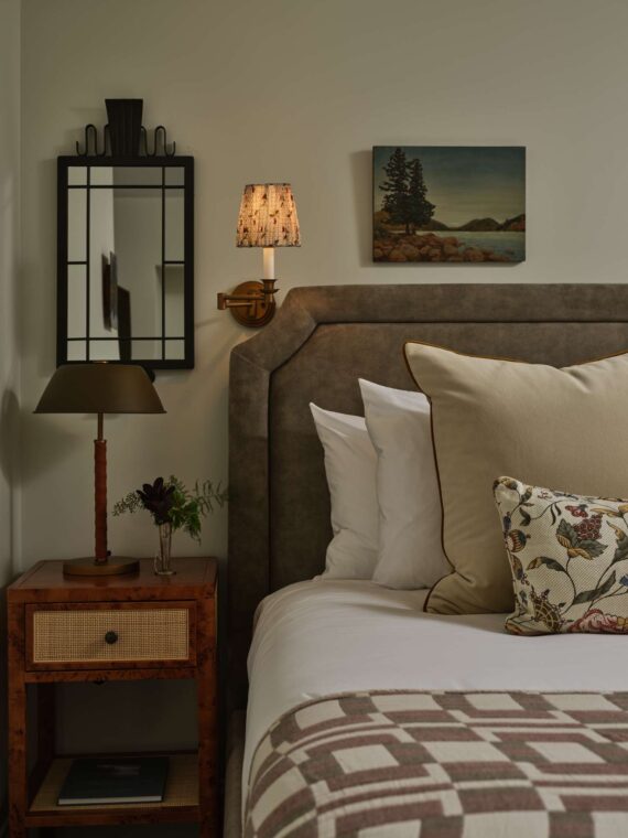 A detail shot of a bed in one of the guestrooms at The Asticou