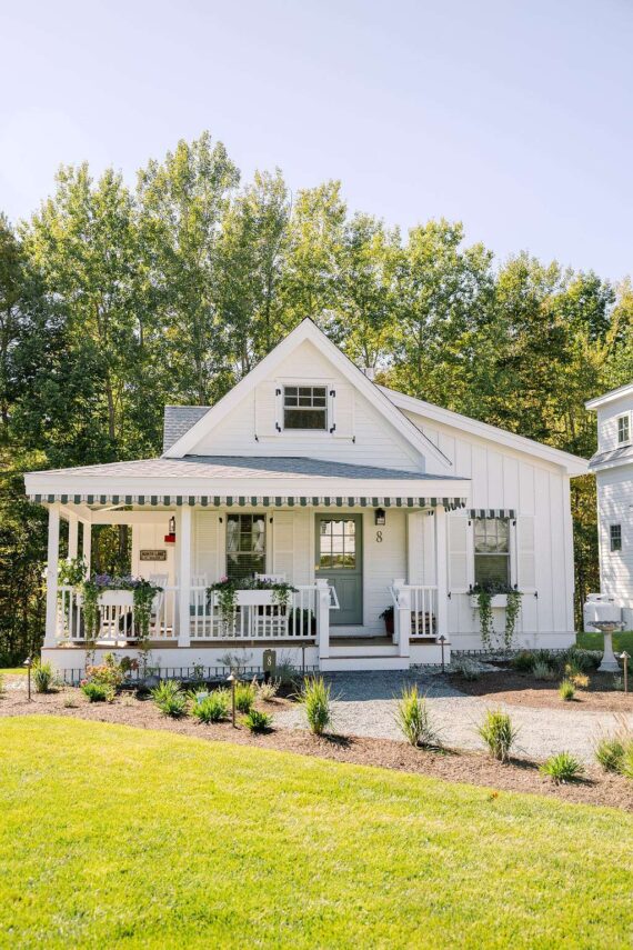 The exterior of one of the Harborside Cottages with a wrap-around porch.
