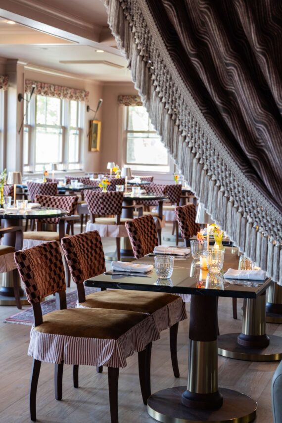 The bright and airy dining room of Dahlia's, the signature restaurant of The Asticou Hotel